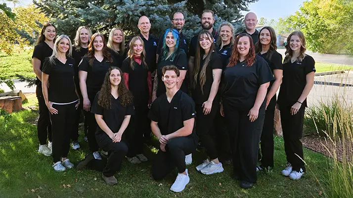 Chiropractor Brian Tolman With Team Outside